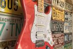 Seth Lee Jones Guitars - workshop hanging red guitar.