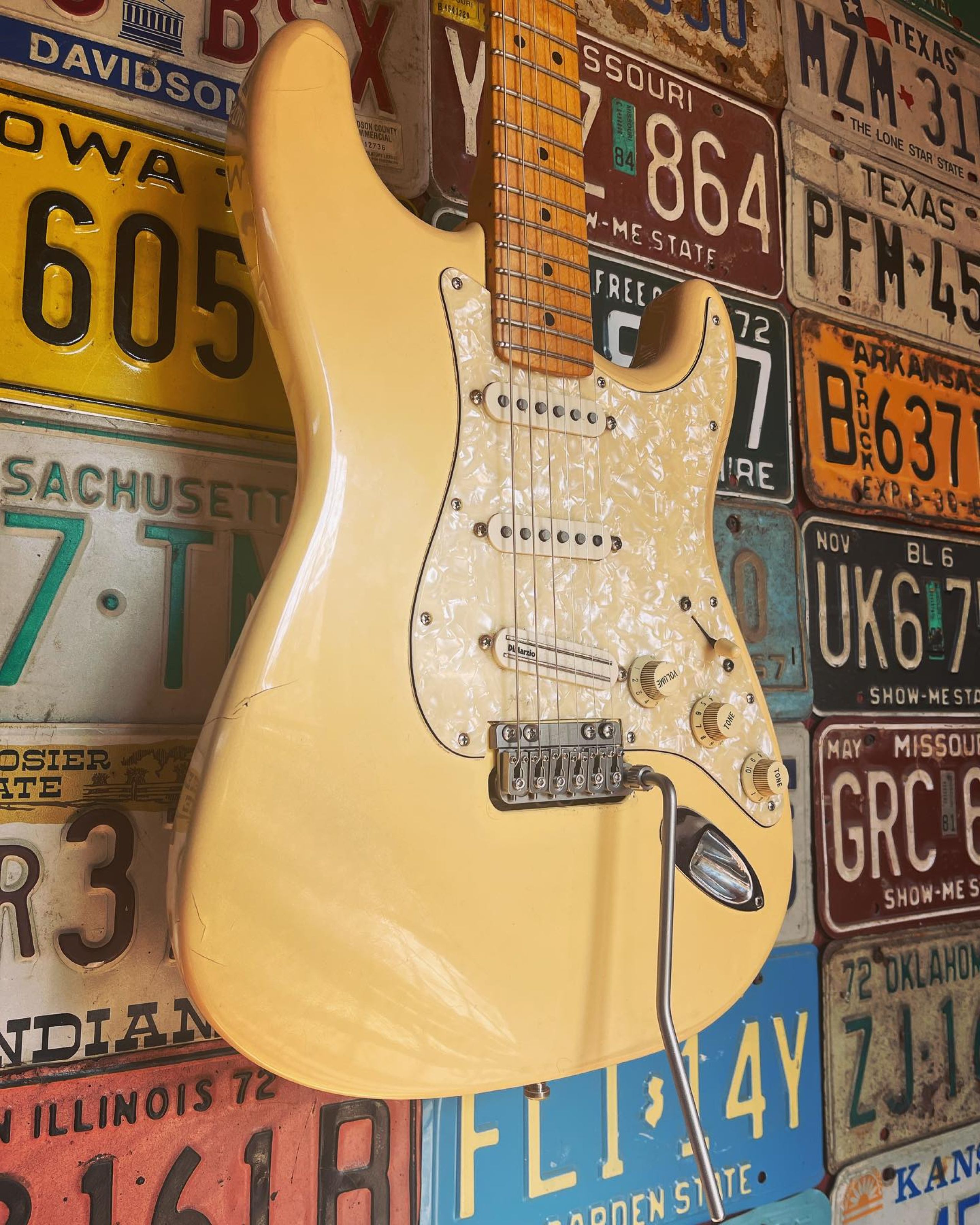 Seth Lee Jones Guitars - workshop hanging cream guitar.